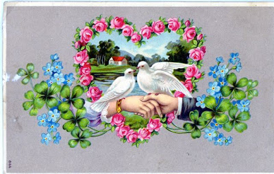 June 7, 1911, postcard from Lisi to Josef. The two love-birds in a heart of roses, the clasped hands, and the forget-me-not blue flowers speak of love without saying a word.